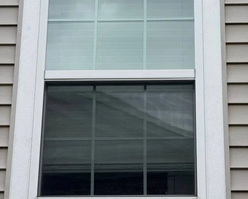 Removing old window trim in Plainfield home